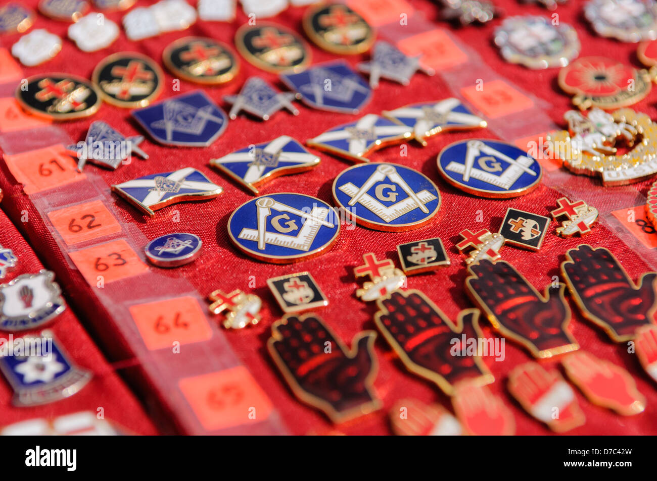 Masonic and Loyalist/Unionist badges on sale at a market stall Stock Photo