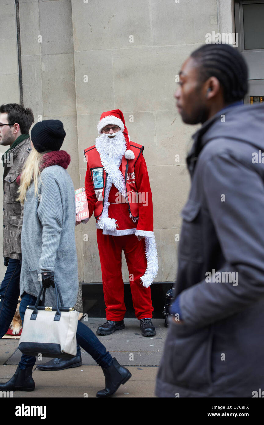 A Big Issue seller dressed as Father Christmas London, England 02.12.