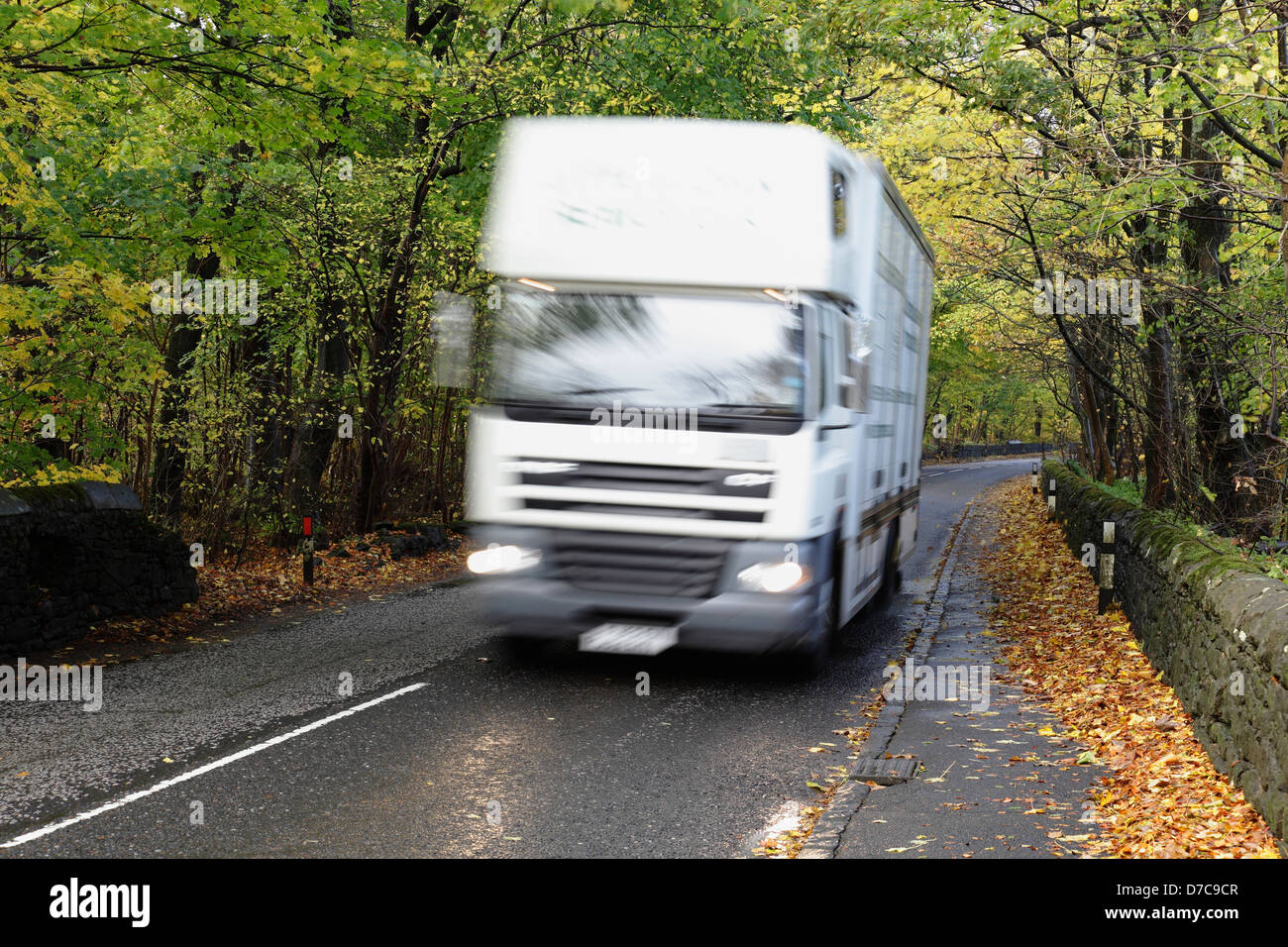 Motion blurred van on a local country road in Autumn, Scotland, UK Stock Photo