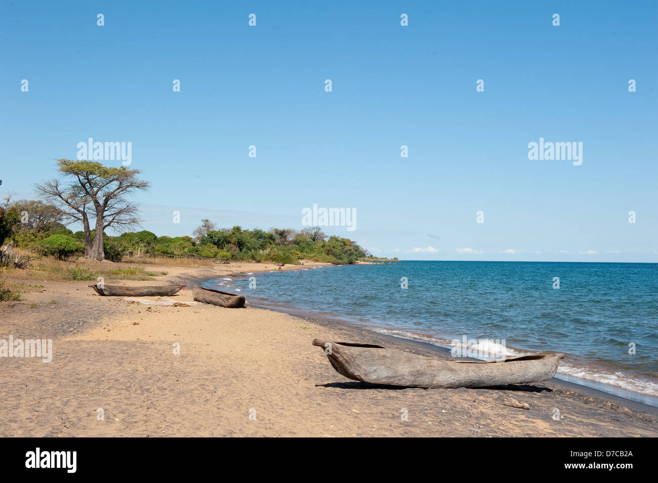 dugout canoes lying on a fishing beach, lake Niassa, Mozambique Stock Photo