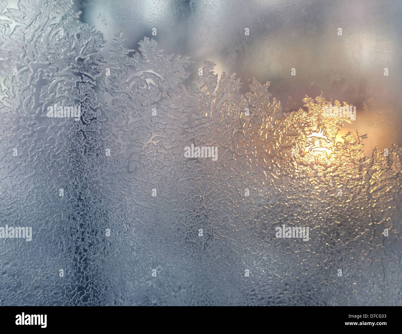 frosty natural pattern and sunlight on winter windowpane Stock Photo ...