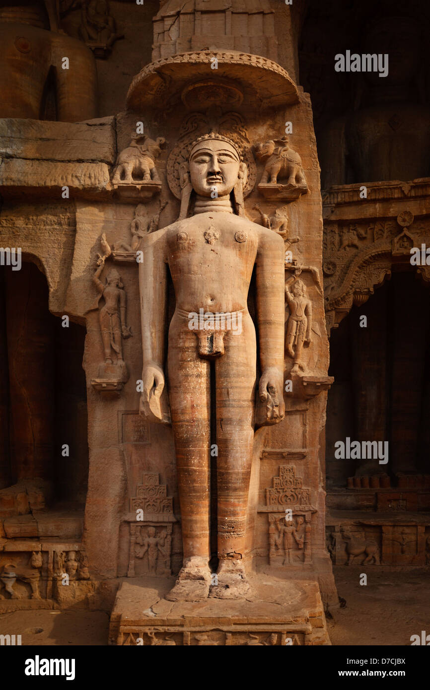 Rockcut Statue of Jain tirthankara in rock niches near Gwalior fort. Gwalior, Madhya Pradesh, India Stock Photo