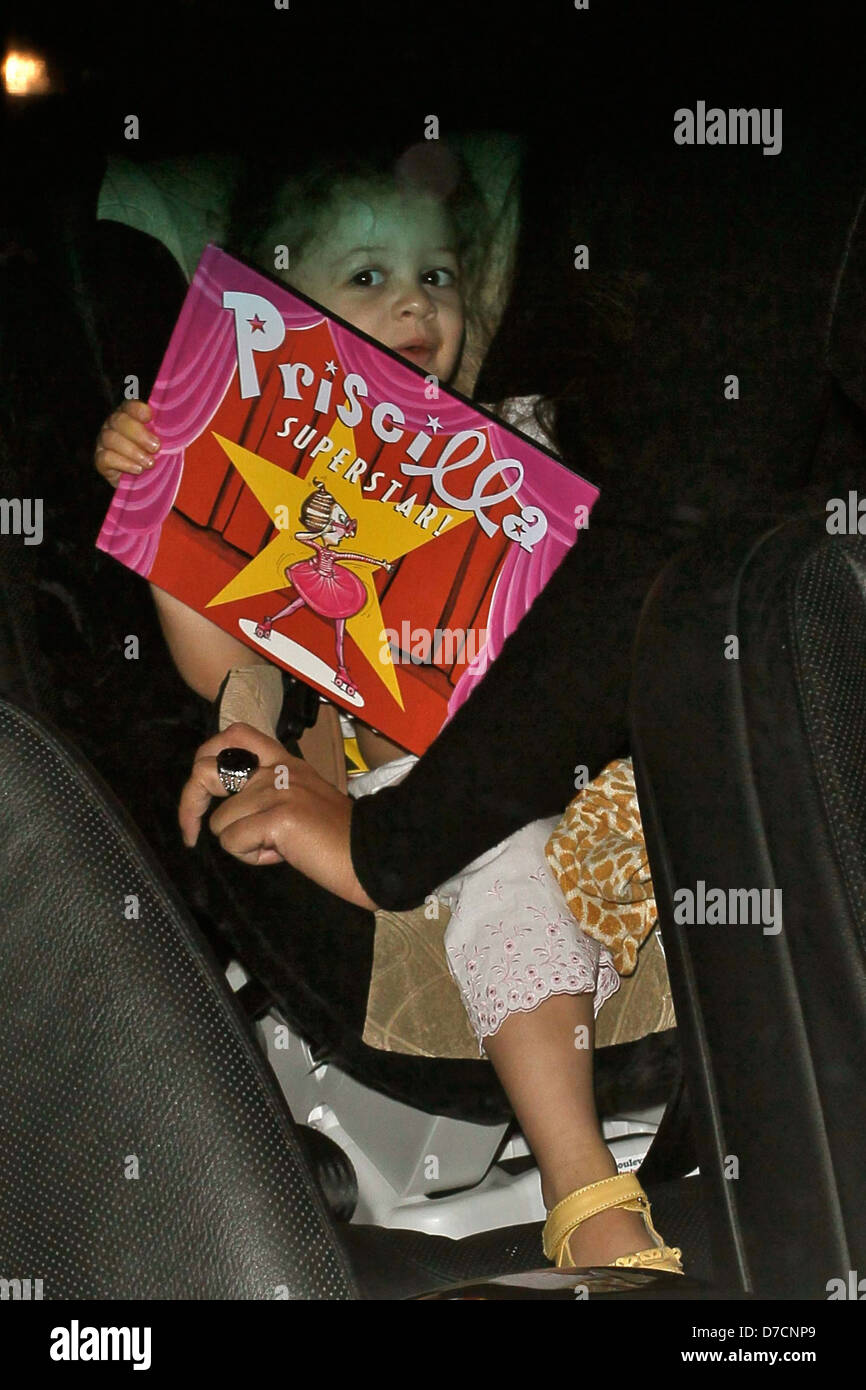 Harlow Madden is put into the back of a waiting SUV as she arrives at