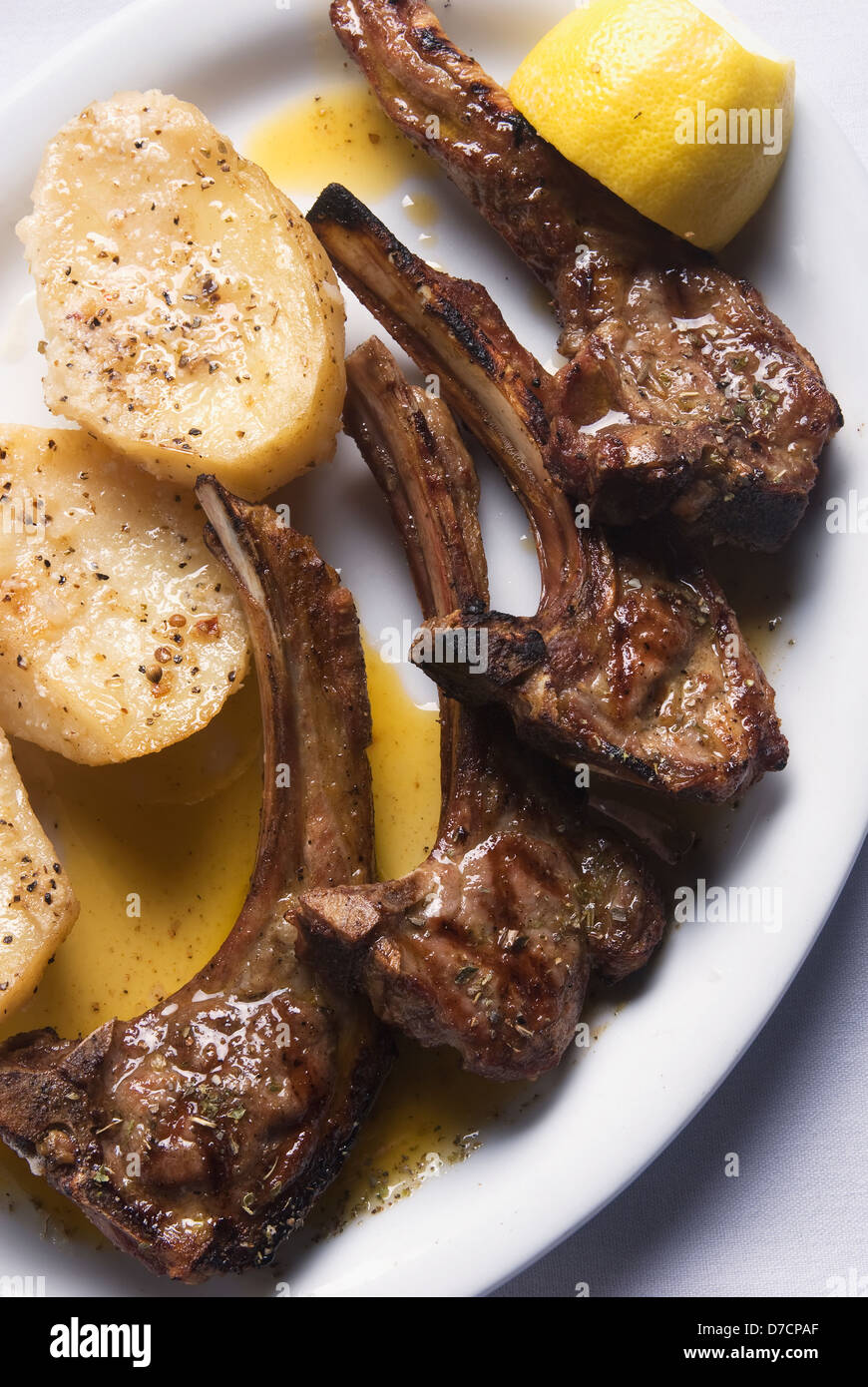 Grilled lamb chops with oven roasted potatoes Stock Photo - Alamy