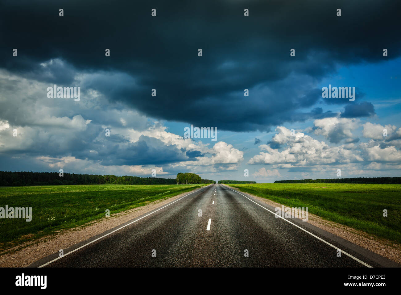 Travel concept background - road and stormy sky Stock Photo - Alamy
