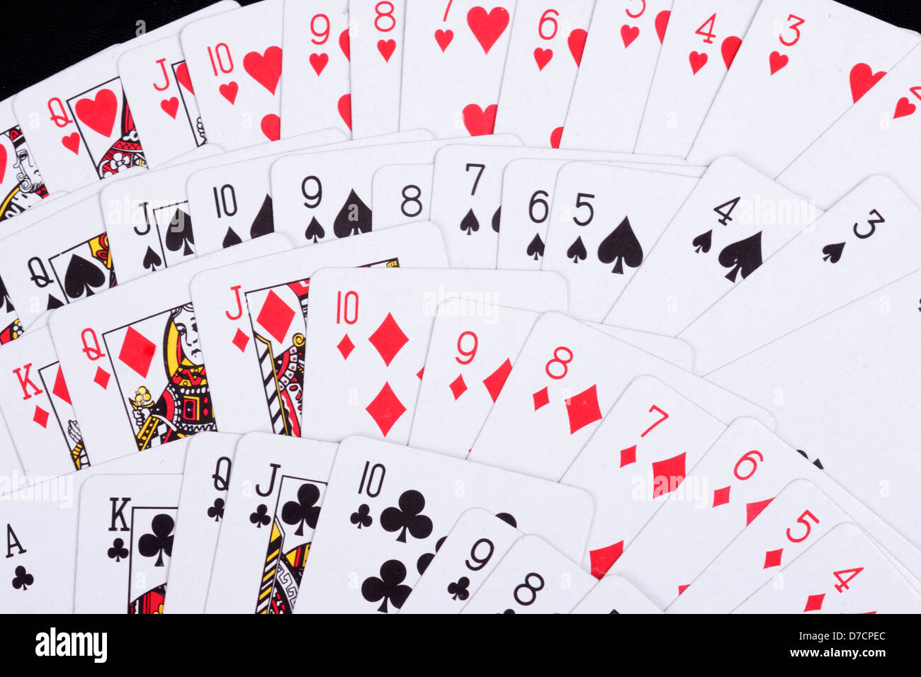 playing cards isolated on a black background Stock Photo - Alamy