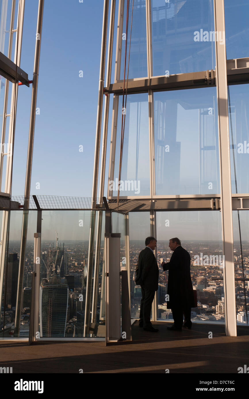 Businessmen Talking On Top Floor Of The Shard London Stock Photo