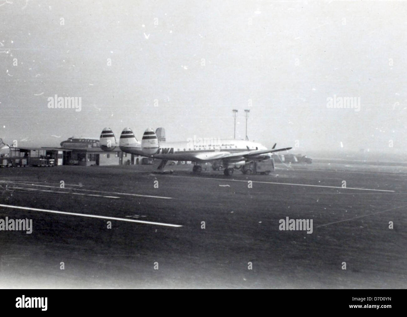 A photograph from Charles Daniels' album taken at LAX in November 1949, showcasing a Lockheed Constellation airliner, a popular propliner of the time. Stock Photo