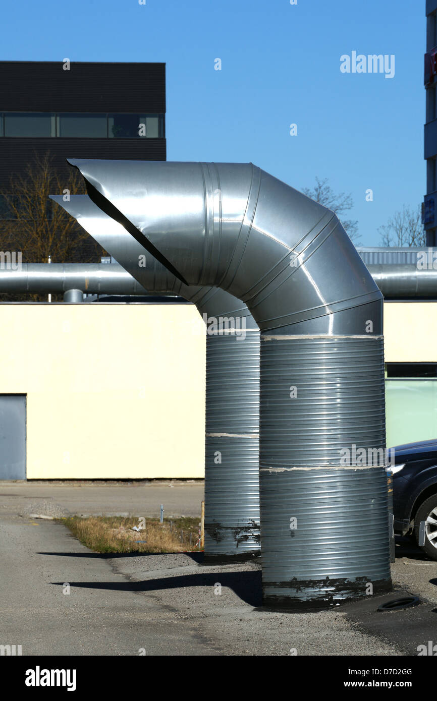 Greater pipes of ventilation are near a building Stock Photo