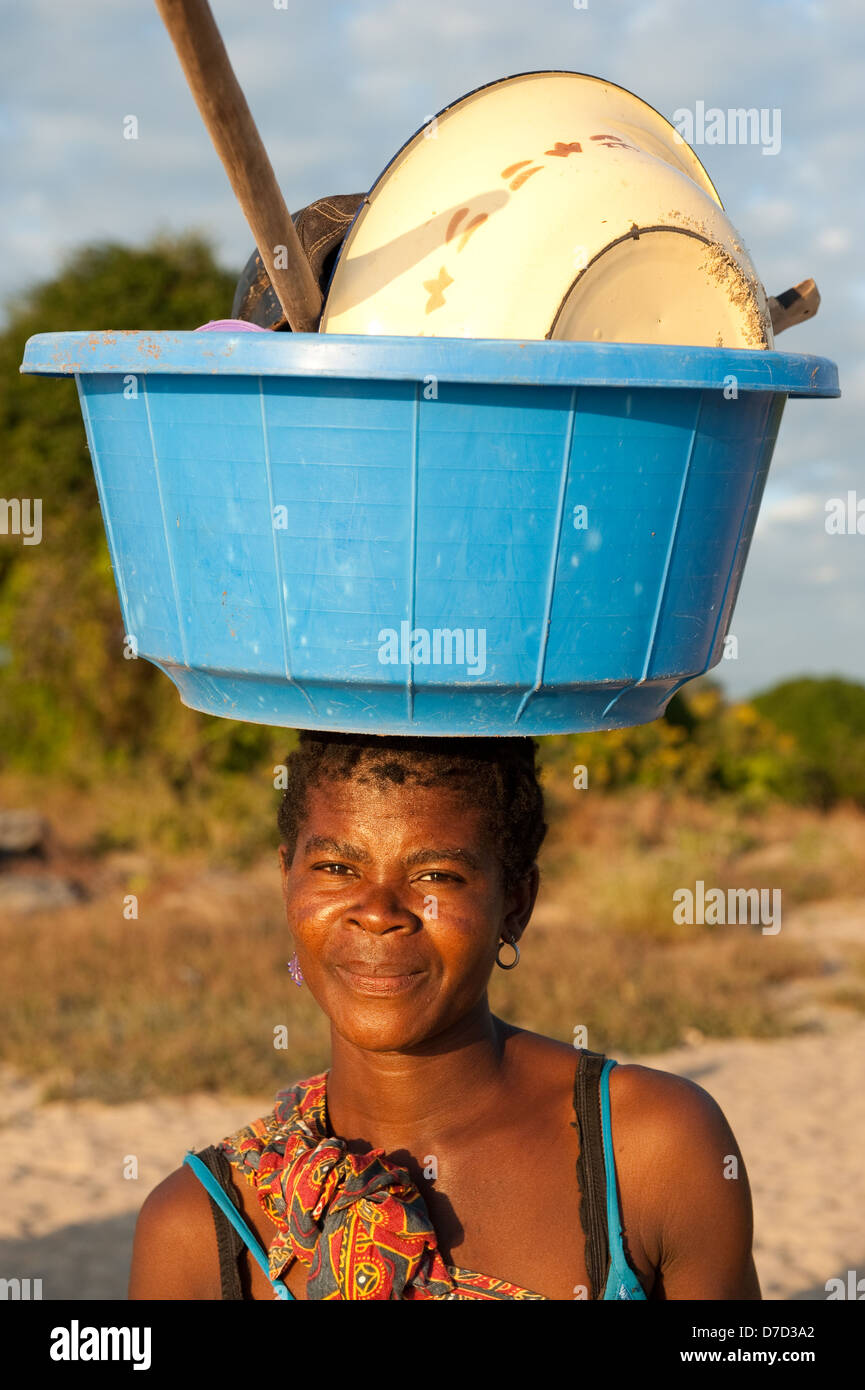 African woman carrying bucket on head hires stock photography and