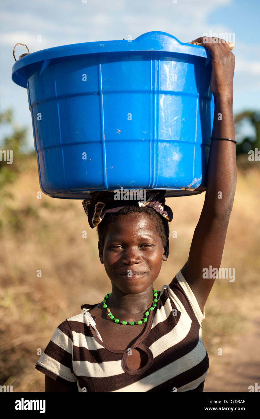 African woman carrying bucket on head hires stock photography and images Alamy