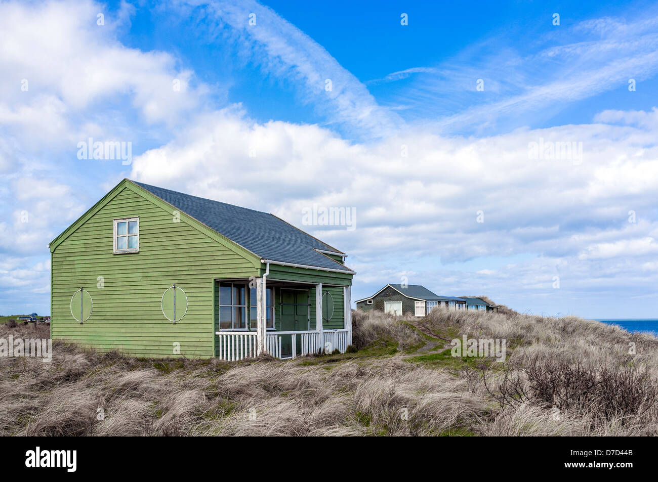 Wooden summer houses on the sand dunes at Dunstanburgh, Northumberland