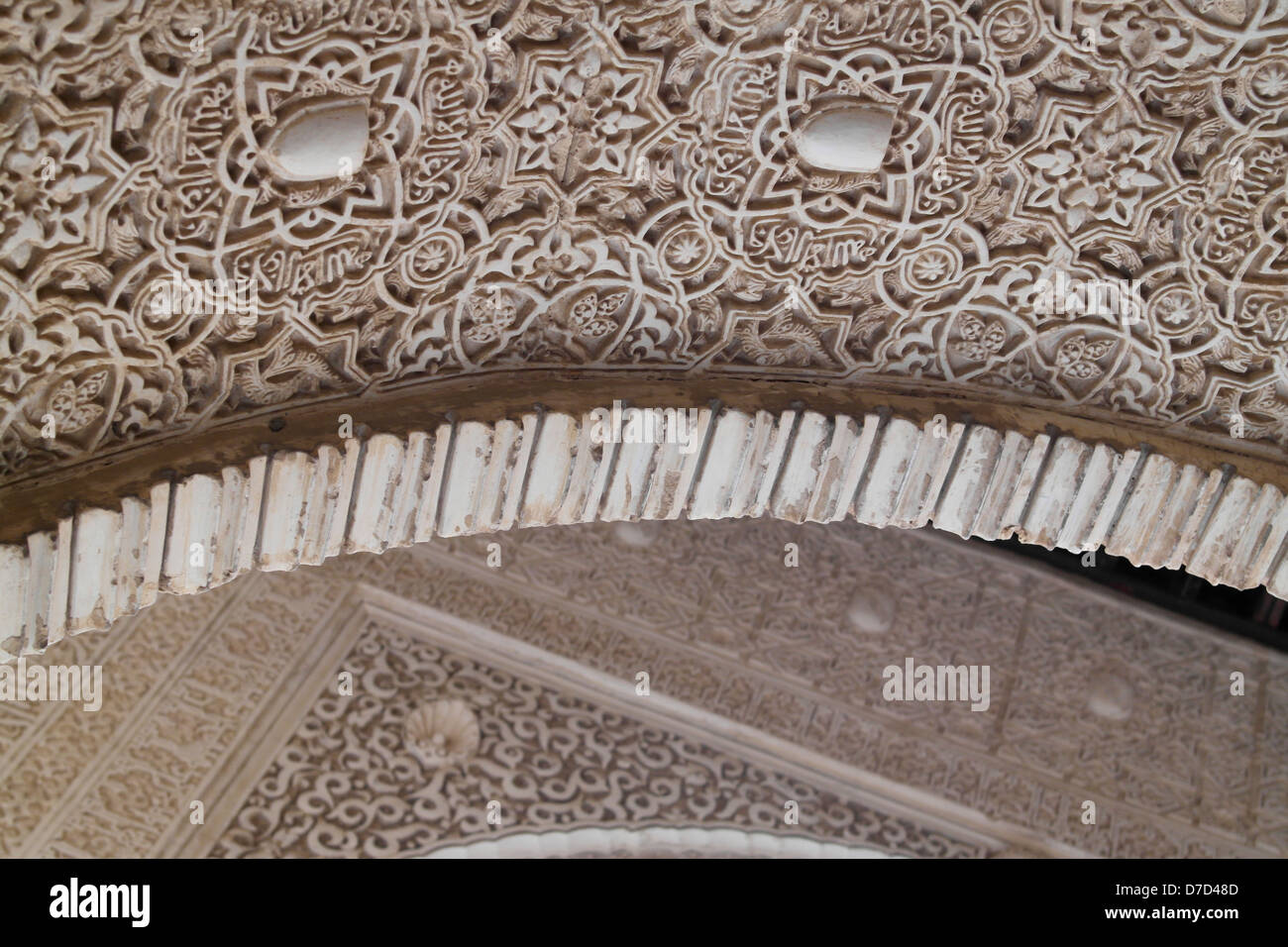 Ornate plasterwork arches at the Nasrid Palace, Alhambra, Granada Stock Photo