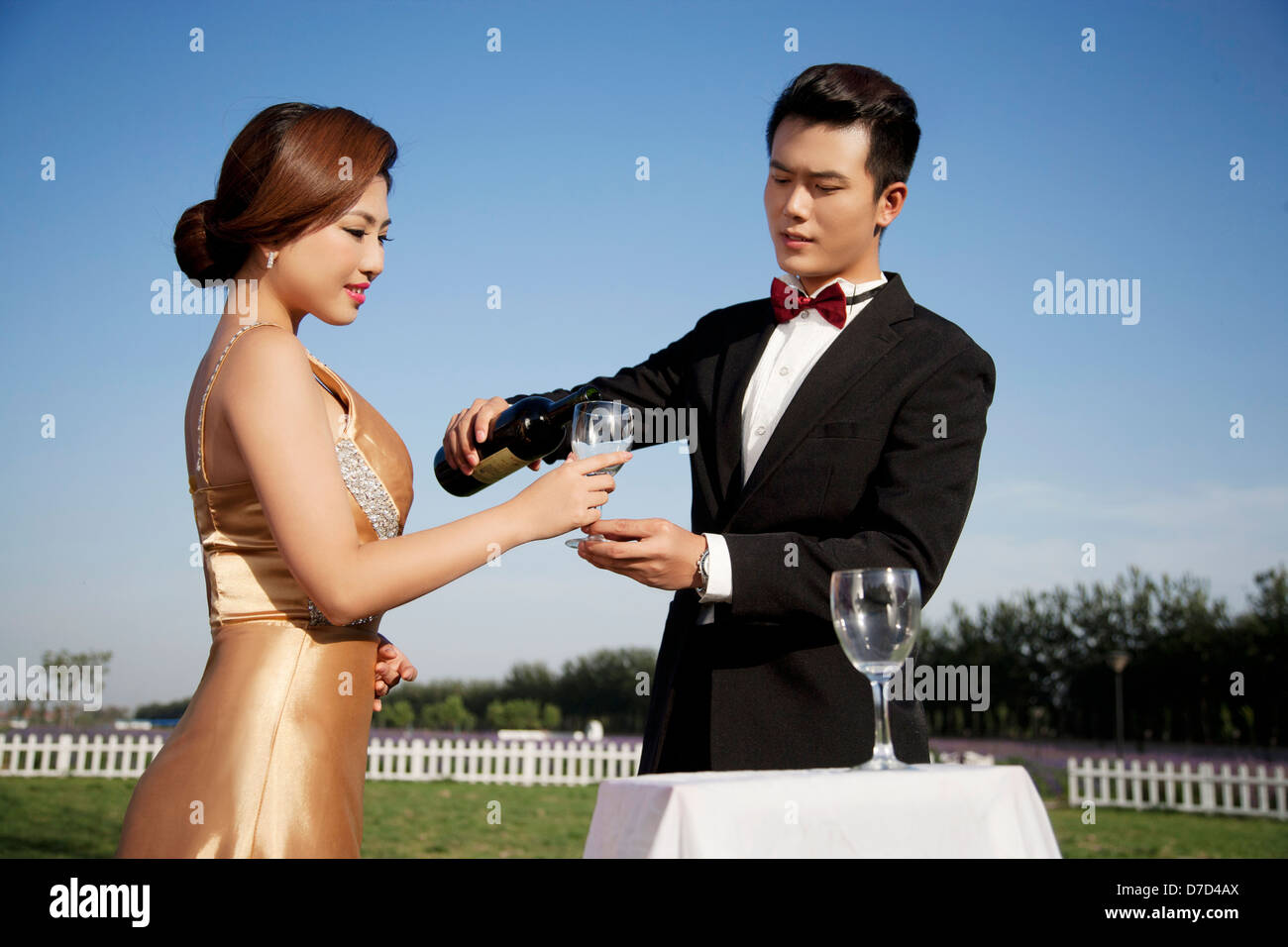 Wearing evening dress fashion of young man and woman in PARTY Stock ...