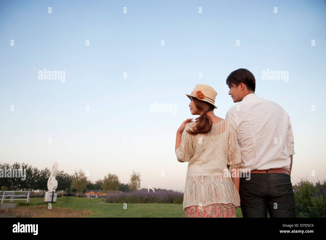 The young couple stand side by side Stock Photo Alamy