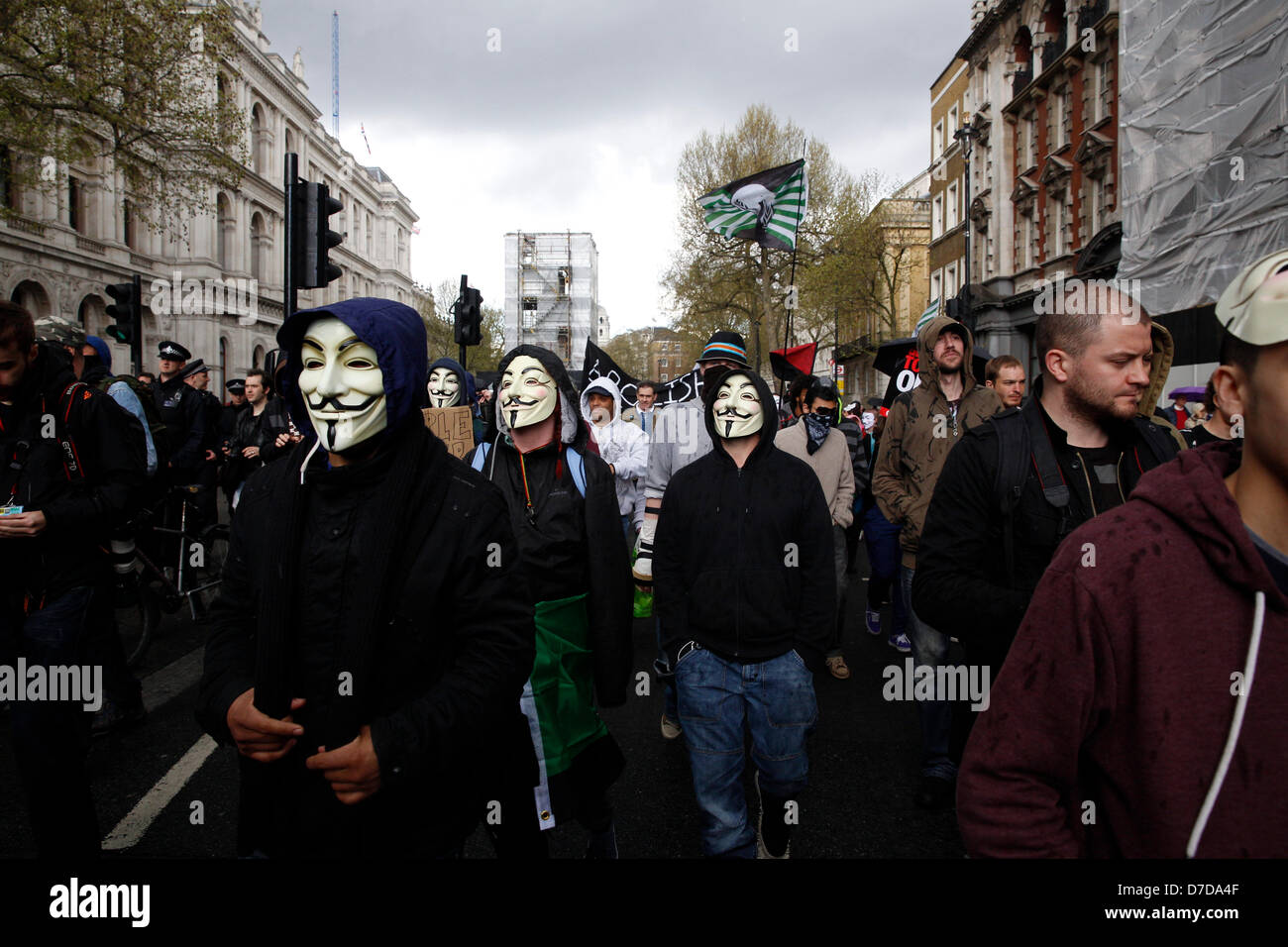 LONDON 4th March 2013. The anonymous protesters gathered at Trafalgar Square to protest against austerity and government cuts. Protesters marched towards Whitehall under police supervision. Stock Photo
