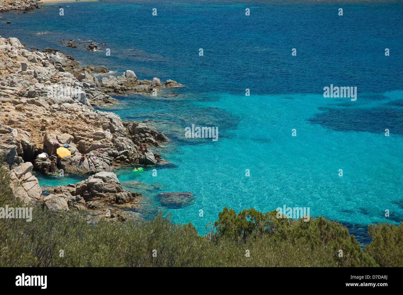 Tourist enjoy the blue sea on the coast near Tuerredda beach, Teulada, Cagliari, Sardinia, Italy Stock Photo