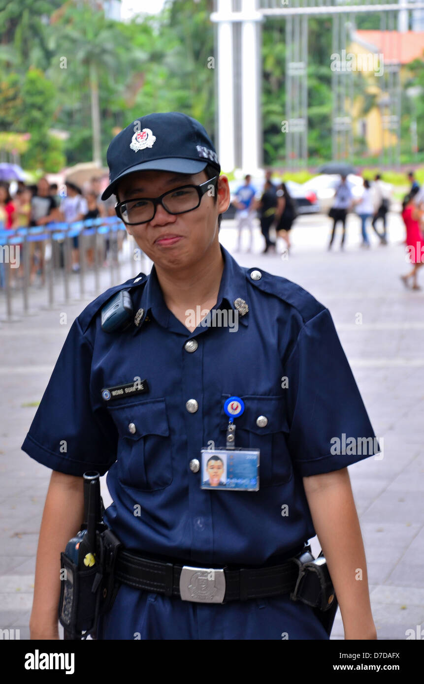 Singapore police constable smiles outside Presidential palace Stock Photo