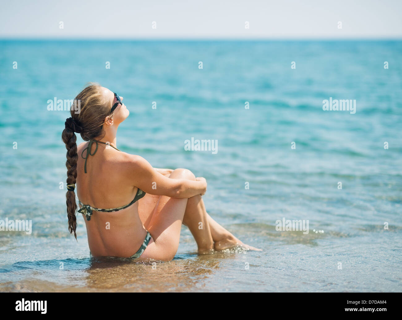 Back view young woman white bikini hi-res stock photography and