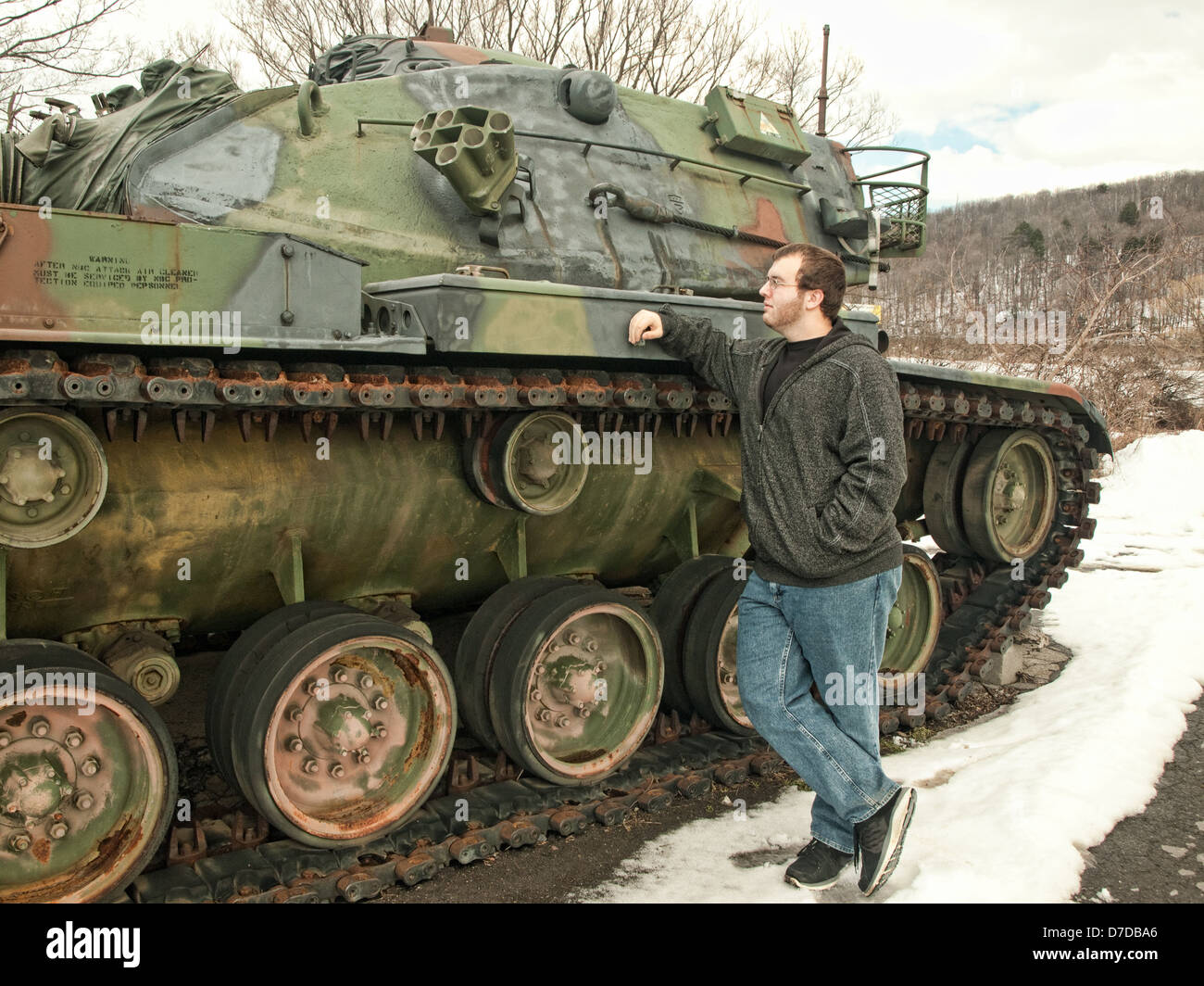 boy studies united states military tank from Vietnam War Stock Photo