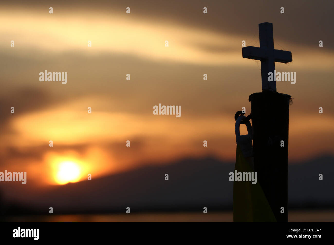 Xanthi, Greece. 3rd May 2013. A cross  on a wooden bridge  in front of Saint Nicolas Orthodox church in Vistonida lake at Porto Lagos in northern Greece. Millions of Greeks flock to churches around the country this week to celebrate Easter, the country's foremost religious celebration.. Credit:  Yiannis Kourtoglou / Alamy Live News Stock Photo