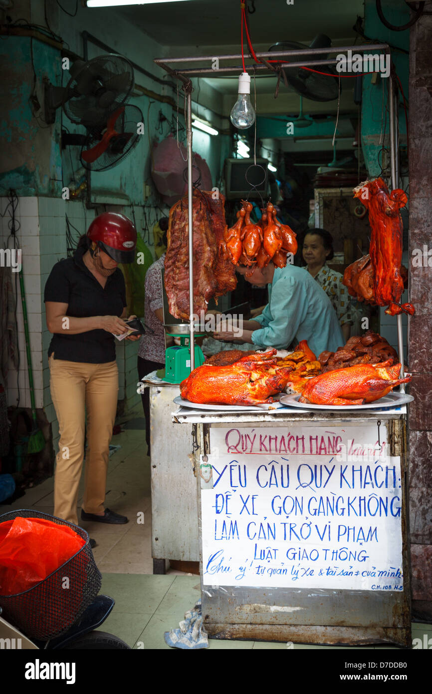 A street vendor selling goose, pork and duck in the Old Quarter of Hanoi Stock Photo