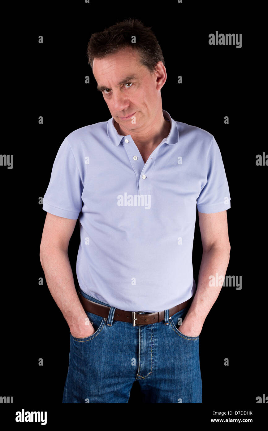 Grumpy Frowning Middle Age Man with Hands in Pockets Black Background Stock Photo
