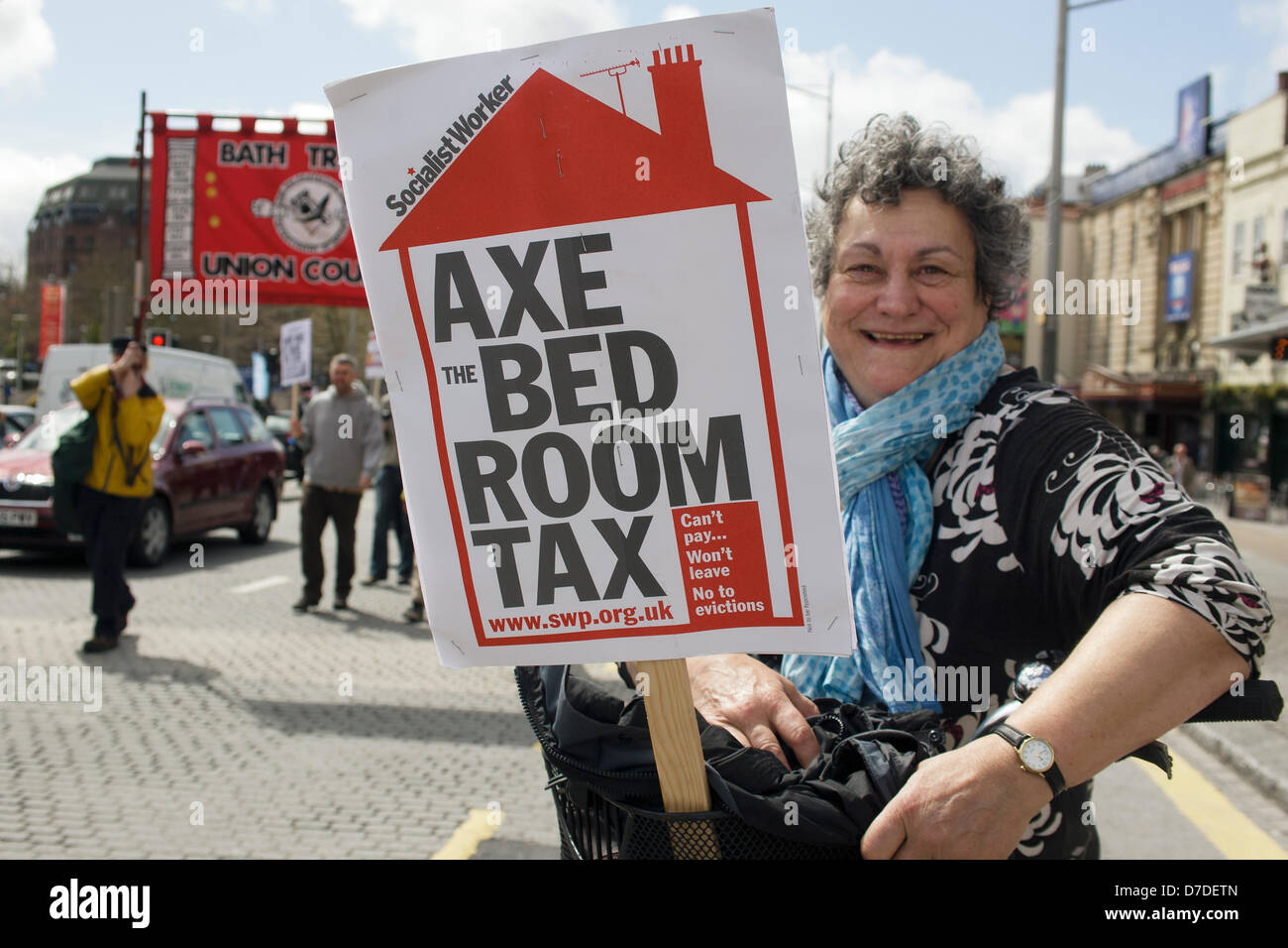 Bristol,UK,May 4th,2013. A woman protester carrying a placard protesting about the bedroom tax takes part in a protest march against government cuts. Credit:  lynchpics / Alamy Live News Stock Photo