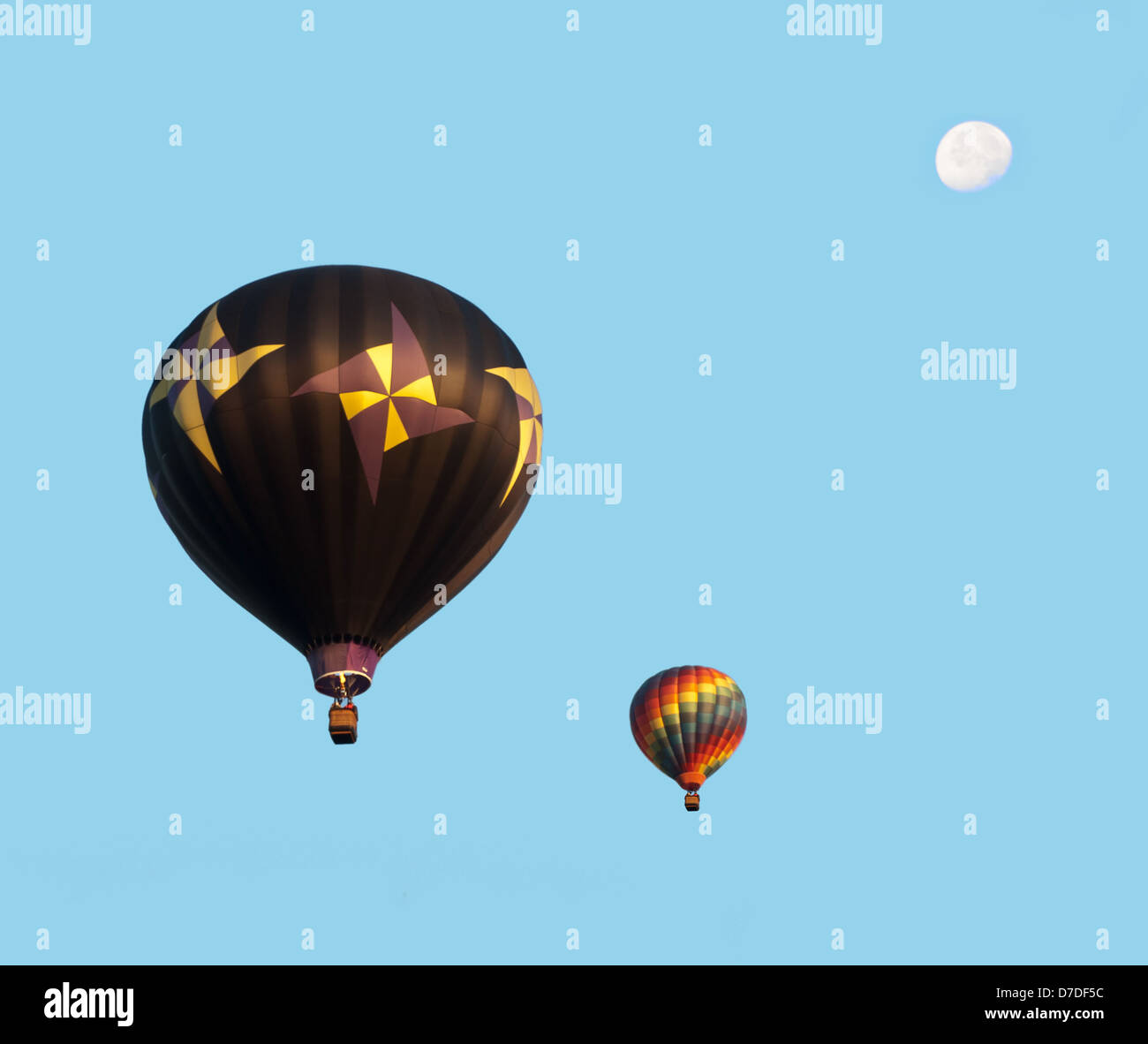 two hot air balloons and moon Stock Photo