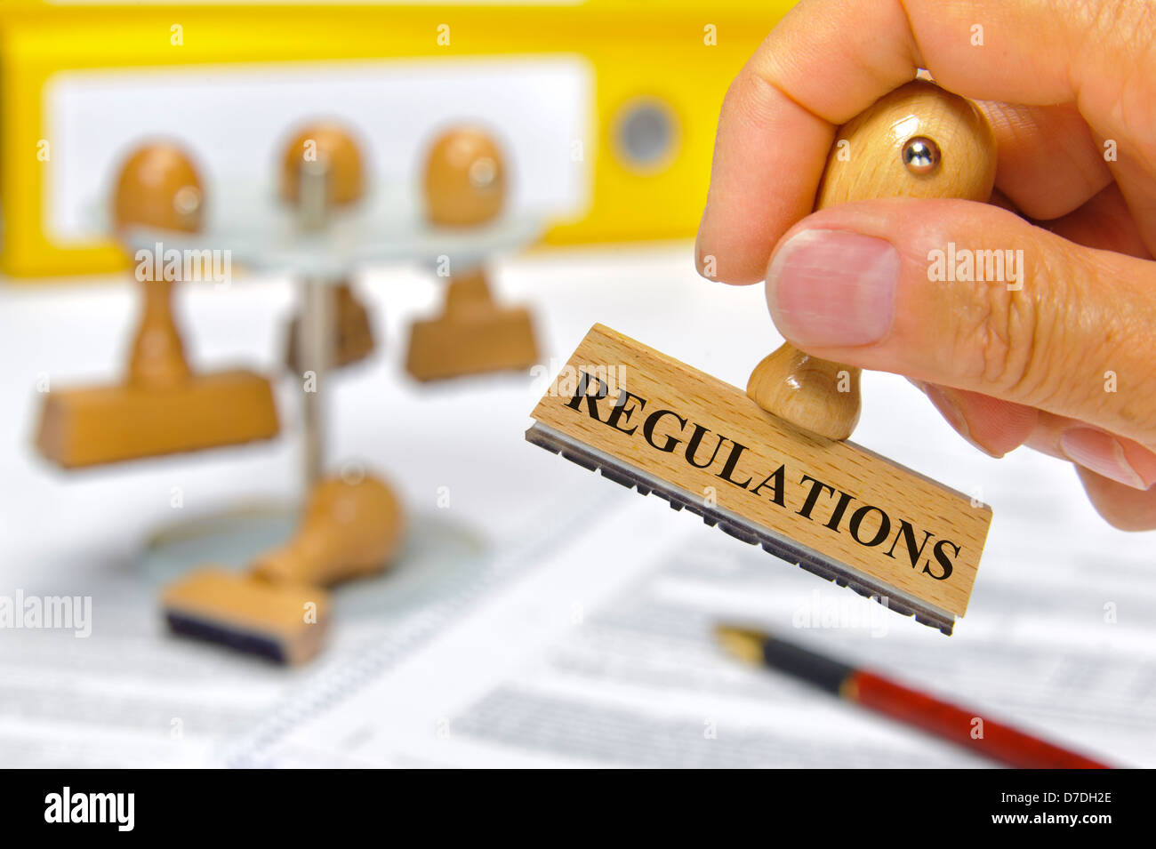 regulations marked on rubber stamp Stock Photo
