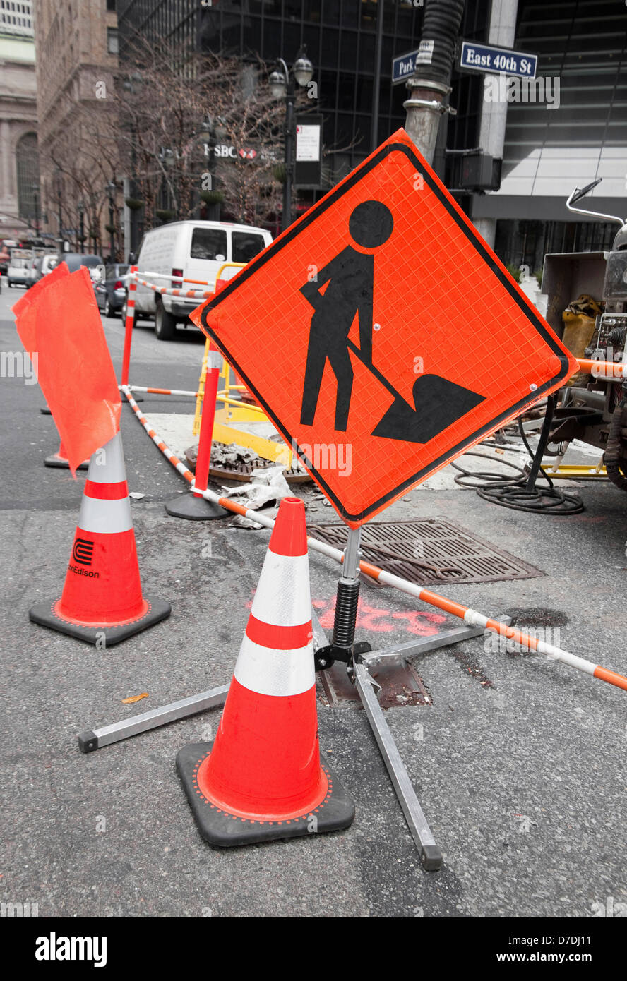 Under construction (symbol) sign alerting drivers and walkers. Stock Photo