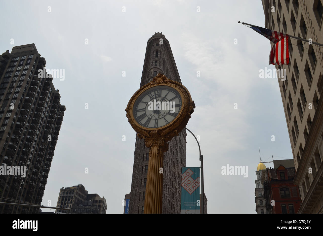 Clock and the Flatiron Building in New York City Stock Photo