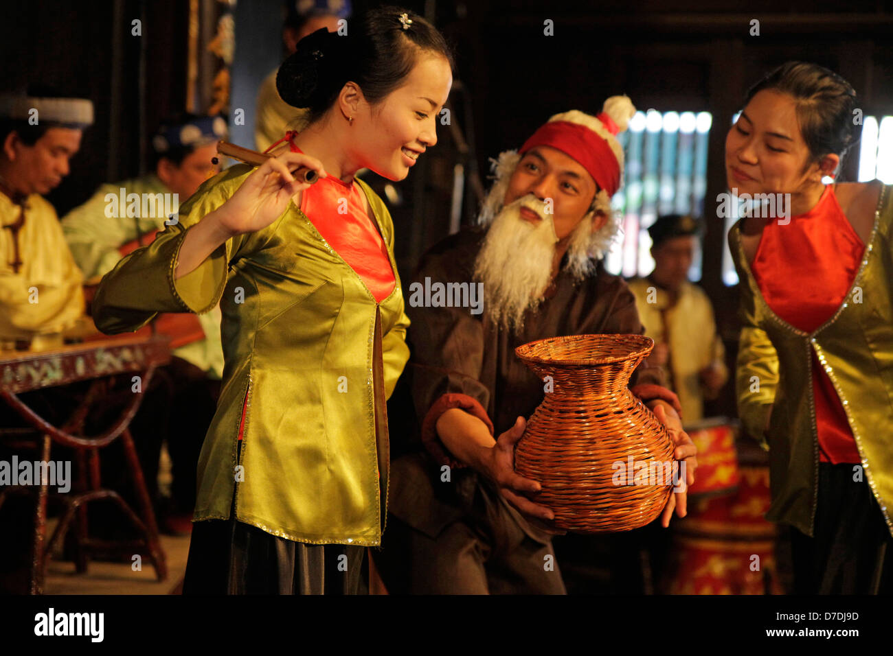 folk songs and folk dances with traditional costumes and instruments in Hoi An, Vietnam Stock Photo