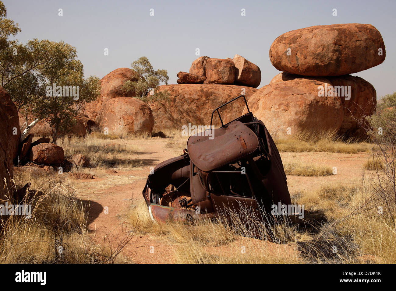 wrecked car at the Devils Marbles near Tennant Creek, Northern Territory, Australia Stock Photo