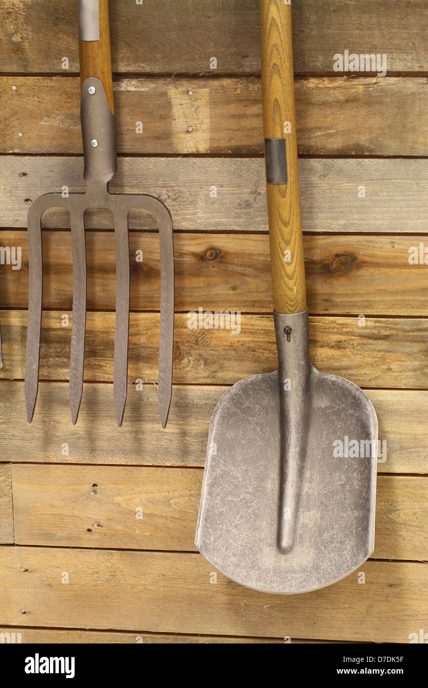 Garden utensils hanging on wooden wall Stock Photo Alamy