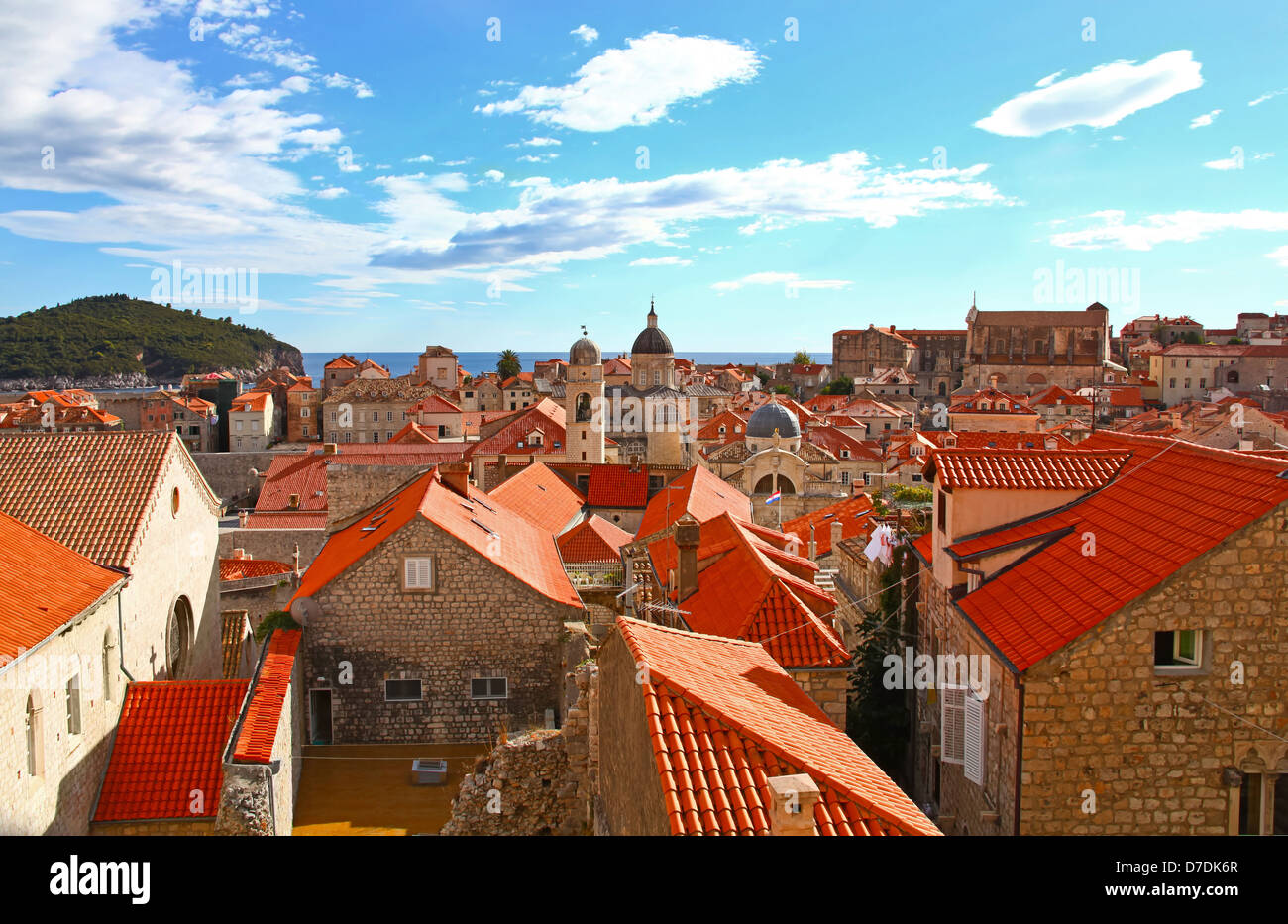 View of many landmarks of Old town in city of Dubrovnik, Croatia. Classic red tiled rooftops with Adriatic sea Stock Photo