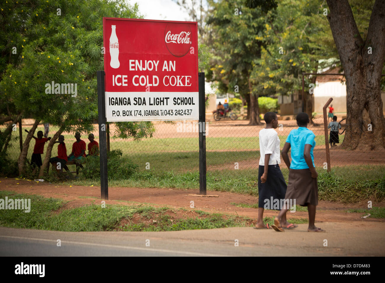 Coca-Cola sponsored school sign in Iganga, Uganda, East Africa. Stock Photo