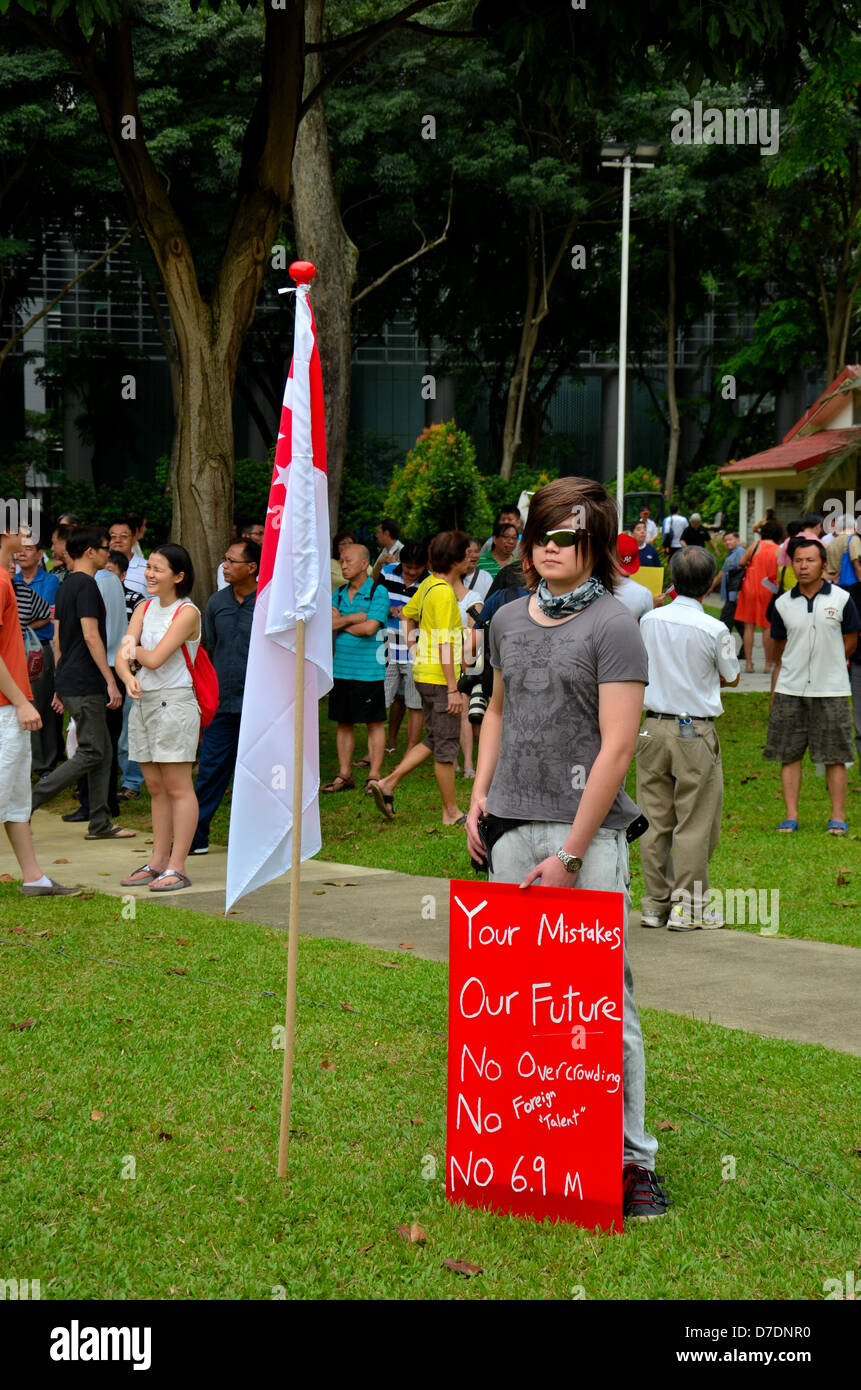 Protester with flag and placard Singapore May Day rally Stock Photo
