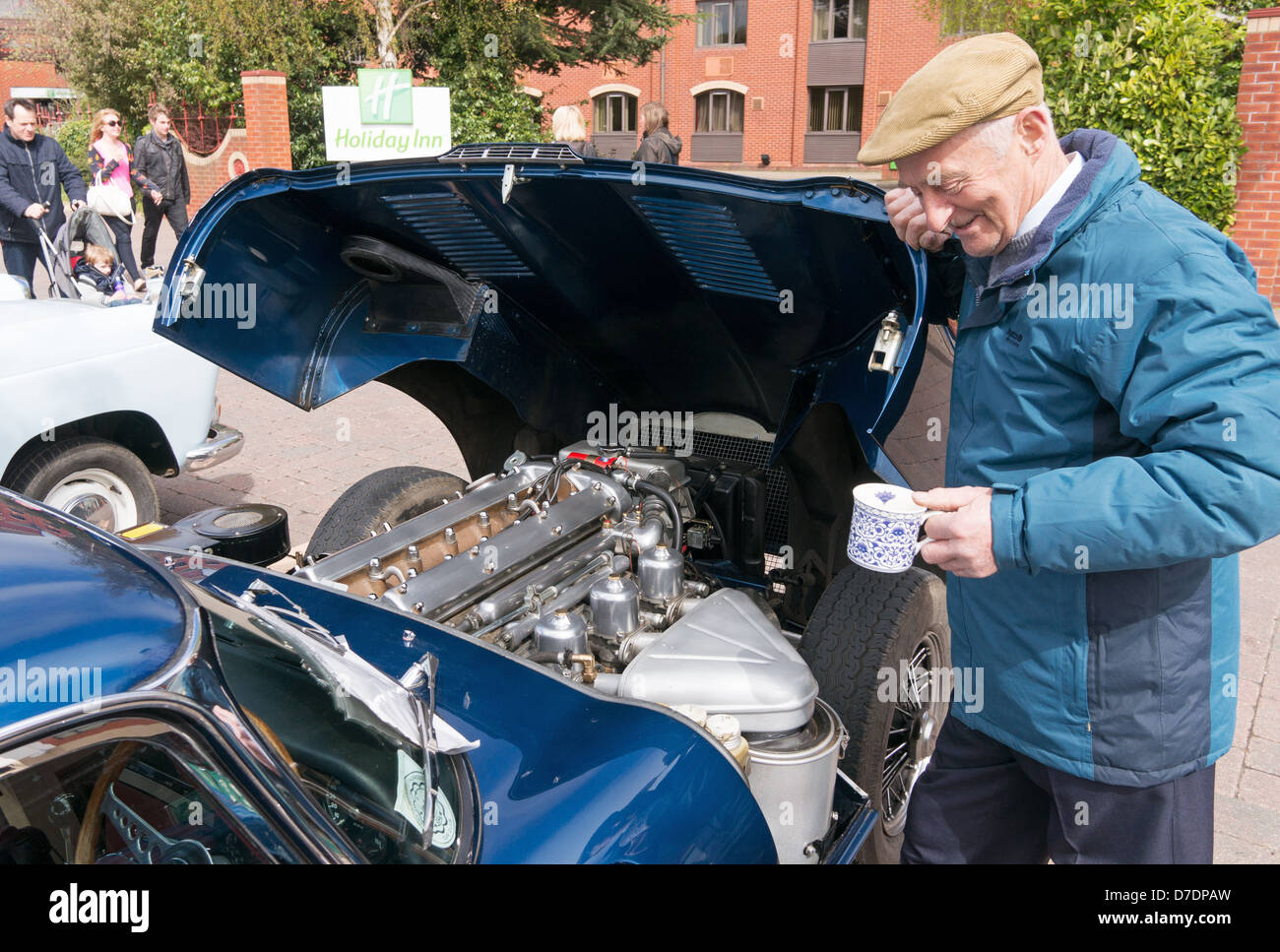 Proud owner shows off 4.2 L engine of restored Jaguar E type car Lincoln Classic Car Rally, England, UK Stock Photo