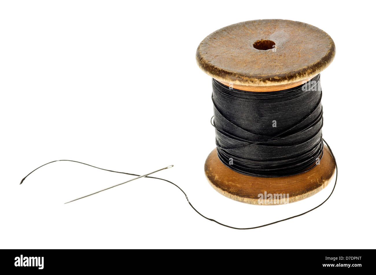 Cotton Reel with Sewing Needle Stock Photo - Alamy