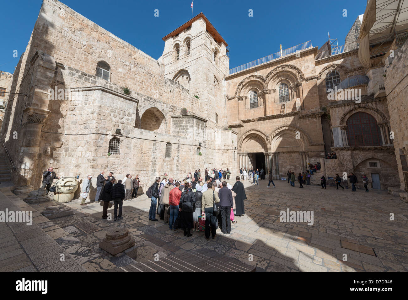 Church of the Holy Sepulcher in Jerusalem with tourists and pilgrims outside Stock Photo