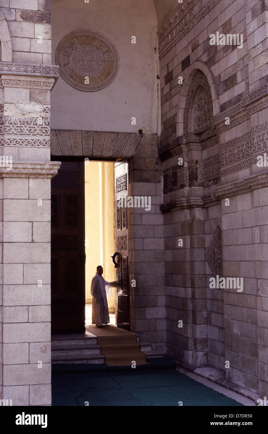 The monumental entrance with its projecting stone porch of Al Hakim mosque nicknamed al-Anwar named after Al-Hakim bi-Amr Allah (985–1021), the sixth Fatimid caliph and 16th Ismaili Imam located in Islamic Cairo Egypt Stock Photo