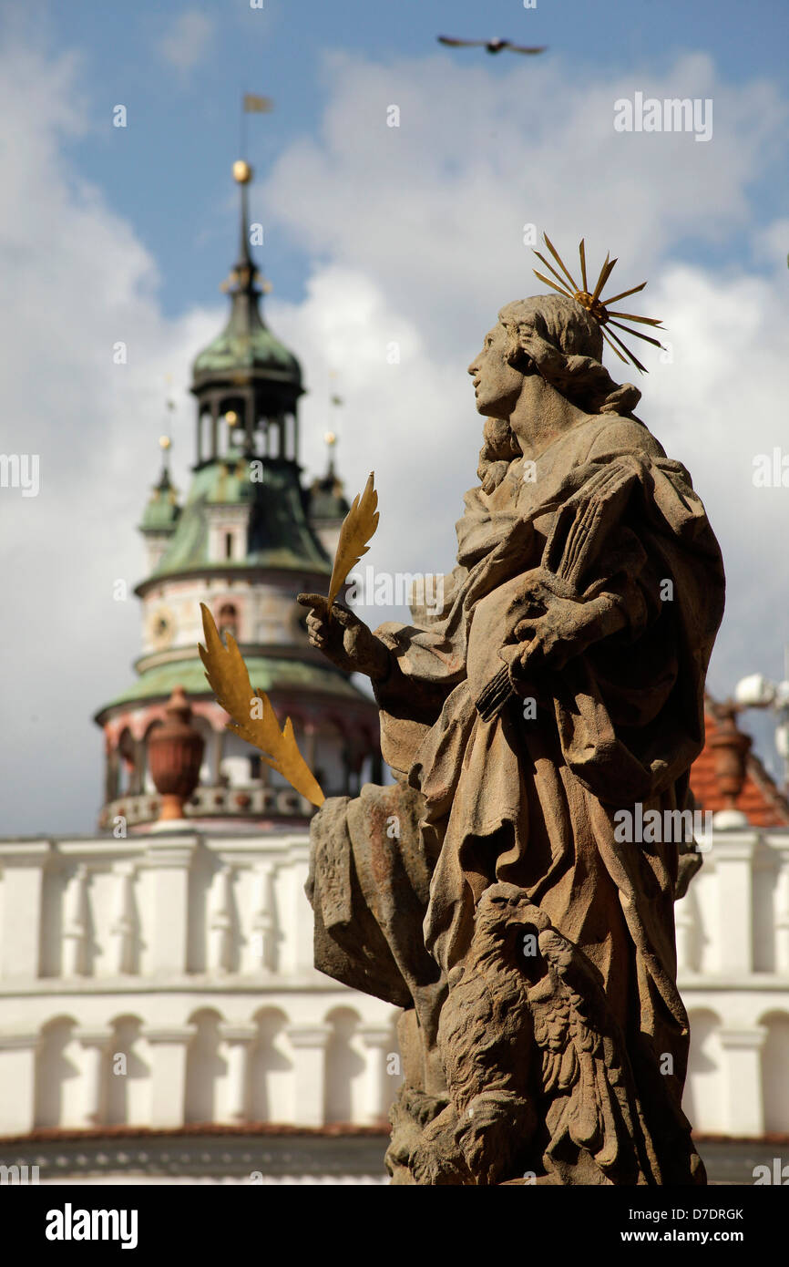 Statue of the Marian column on market square, the tower of the castle at back, Cesky Krumlov, Czech Republic, Europe Stock Photo
