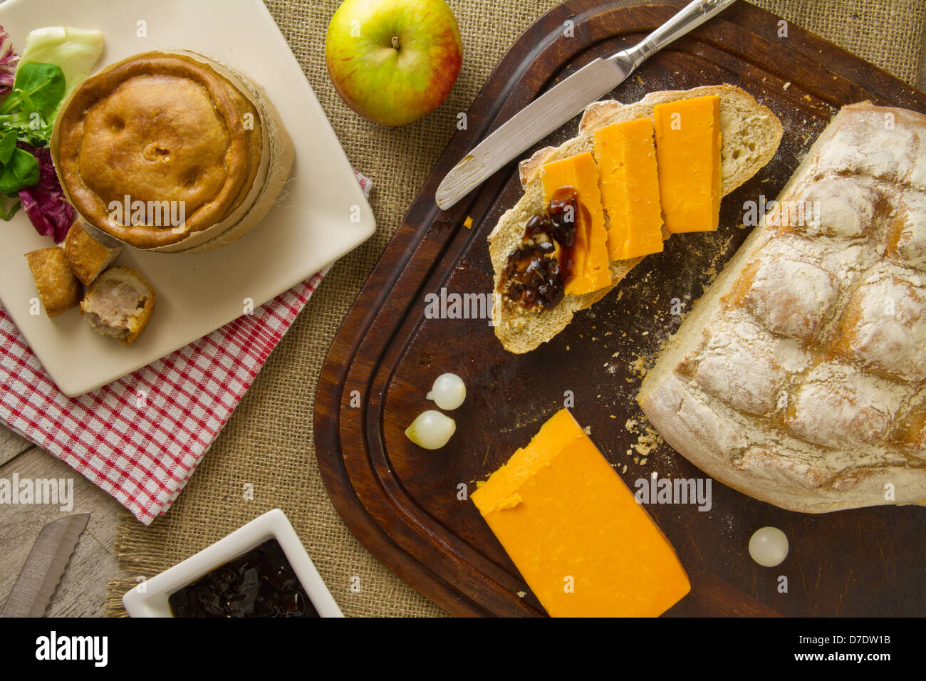 Ploughman's Lunch Spread from above with cut bread Stock Photo
