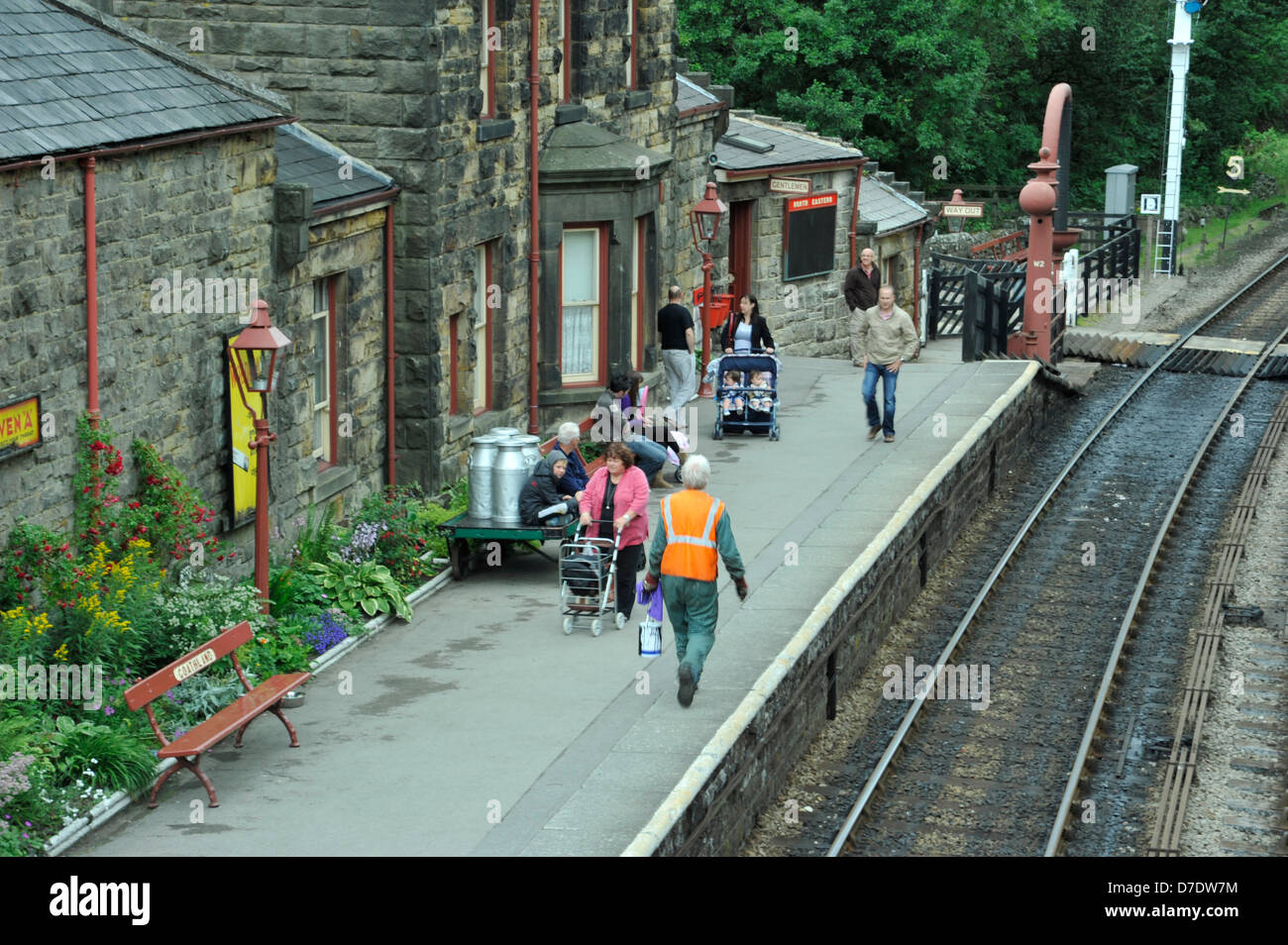 steam train arriving at,Goathland railway station,people,steam,railway lines,long distance Stock Photo