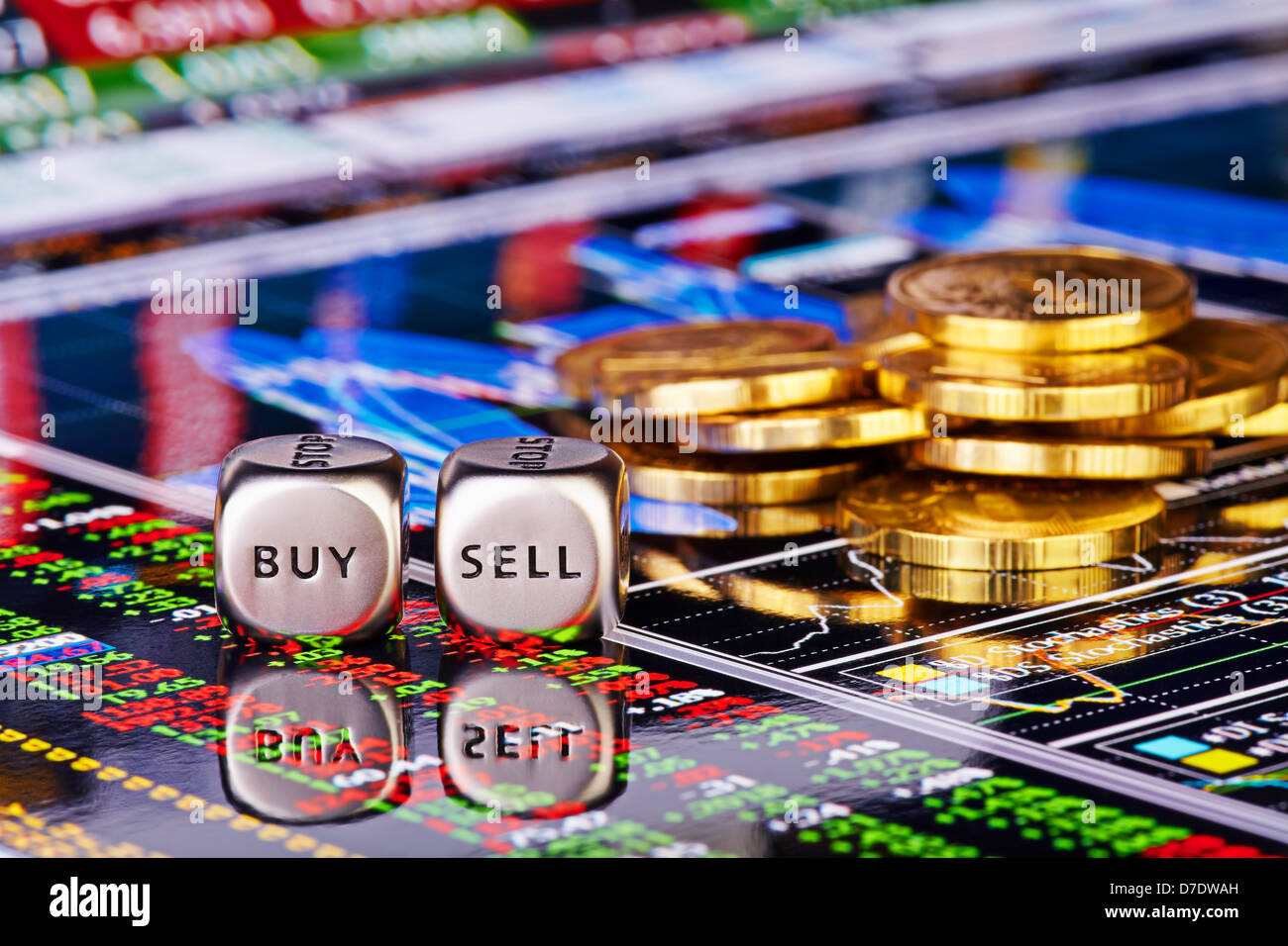 Dices cubes with the words SELL BUY, golden coins and financial chart with the columns of quotations as background. Stock Photo