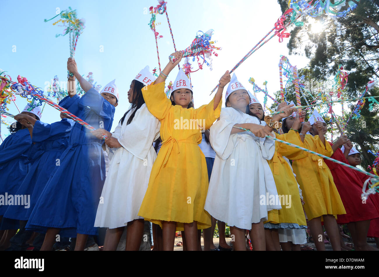 NORTH COTABATO, PHILIPPINES, 5TH MAY 2013 - Litthe children wearing a Dwarf attire wave thier colorfull sticks during the openning of the longest zipline in Asia  in Barangay New Israel, Makilala, North Cotabato, Southern Philippines, 5 May 2013. The Newly opened zip-line with 1.3 Kilometers and 1Kilometer long is the Longest zipline in asia according to Department of Tourism (DOT). Every ride will cost Php350 or $8.5. Stock Photo