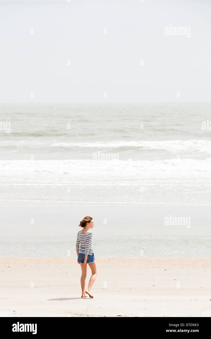 Girl looking at beach Stock Photo