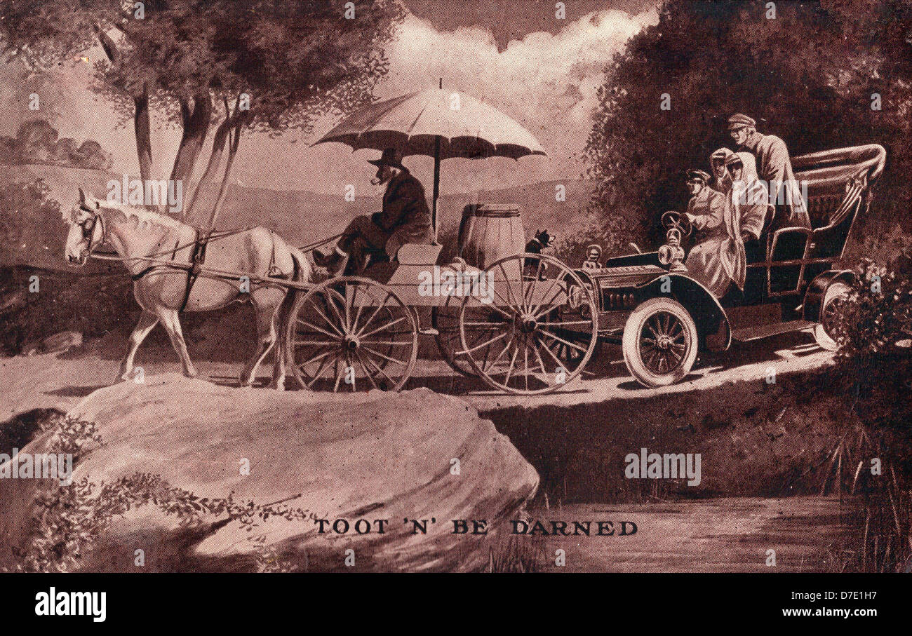 Toot and be darned - an automobile stuck behind a slow moving horse and buggy, circa 1910. Stock Photo