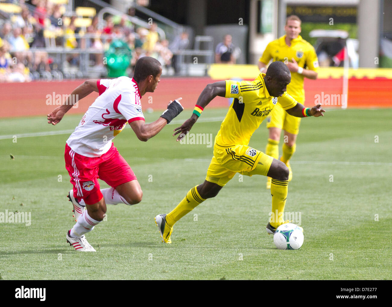 May 4, 2013 - May 04, 2013: Columbus Crew Dax McCarty (11) moves past New York Red Bull Roy Miller (7) during the Major League Soccer match between the New York Red Bulls and the Columbus Crew at Columbus Crew Stadium in Columbus, OH Stock Photo